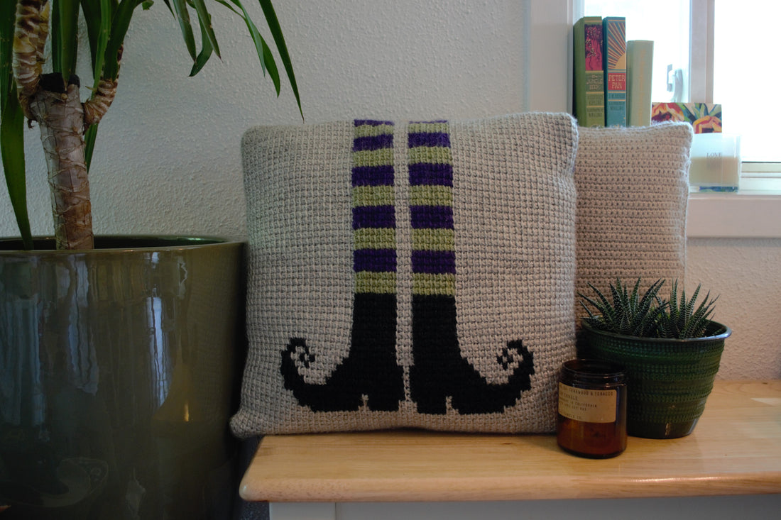 tunisian crochet pillow cover with witch legs