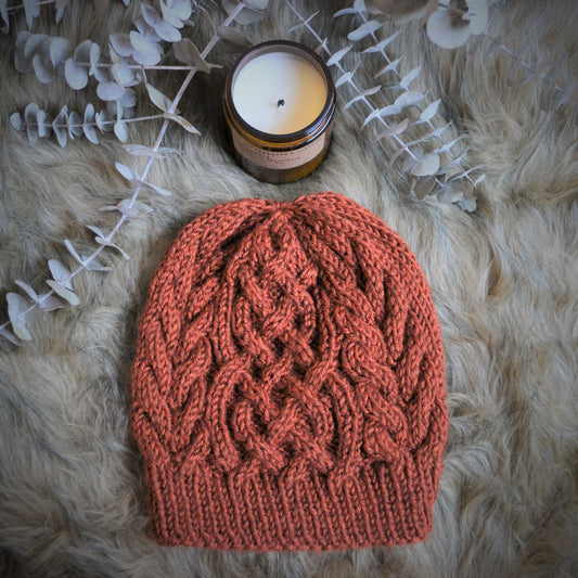 cable knit hat featuring a celtic braid up the middle with braids to each side