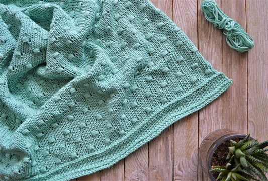 knit baby blanket with bobbles in lion brand 24/7 cotton yarn