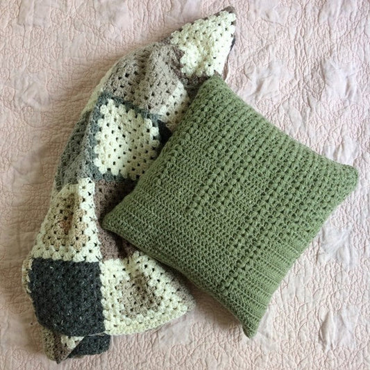 crochet pillow cover featuring vertical puff stitches of various lengths to represent will branches