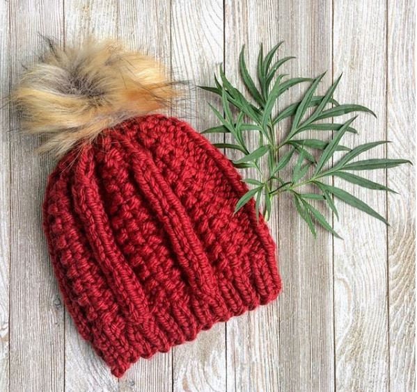 Super bulky knit hat with columns of knit stitch and seed stitch