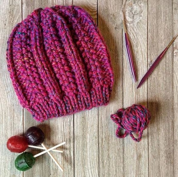 Super bulky knit hat with columns of knit stitch and seed stitch