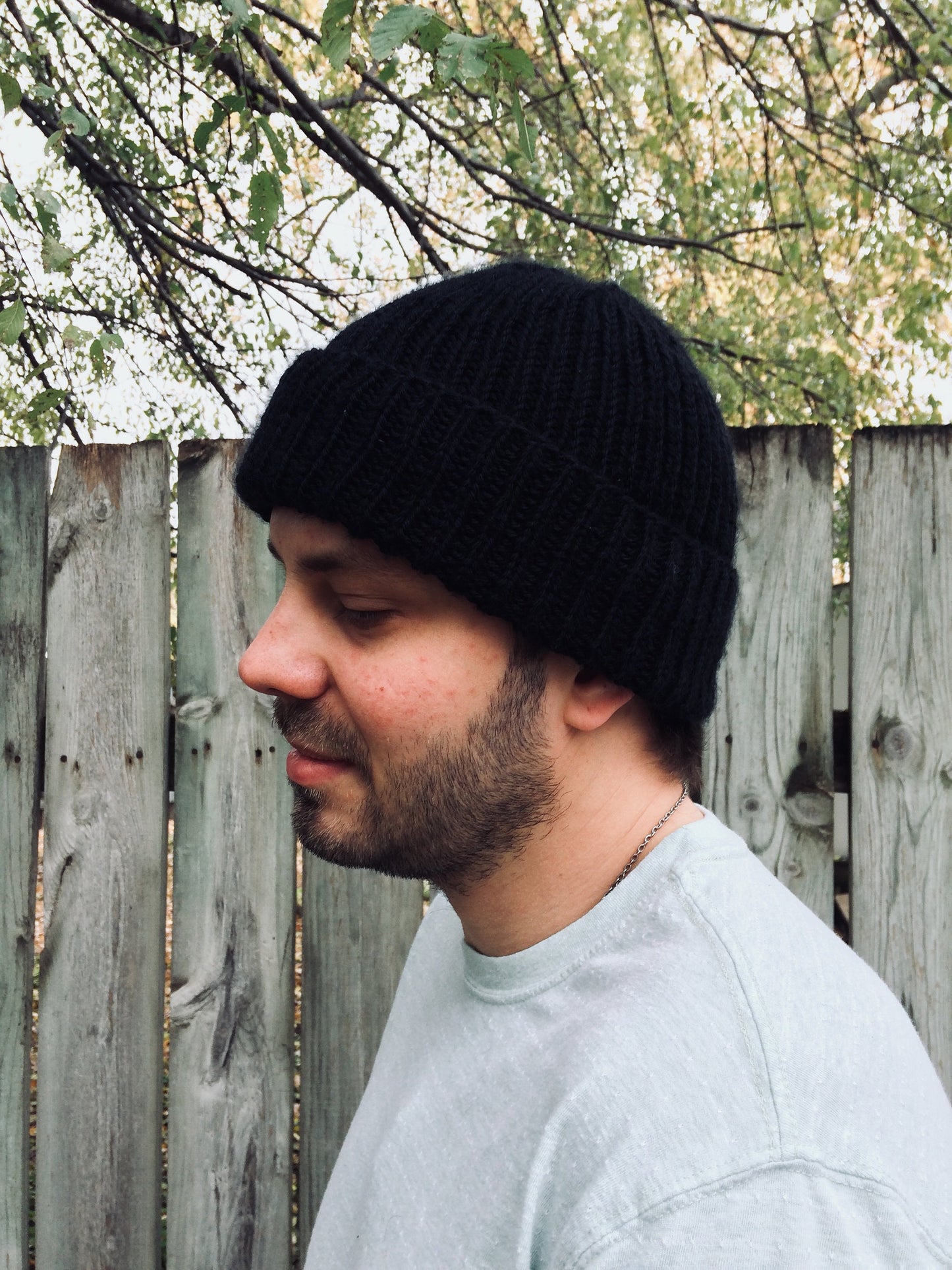 Man with a 1 x 1 knit ribbed hat with a folded brim