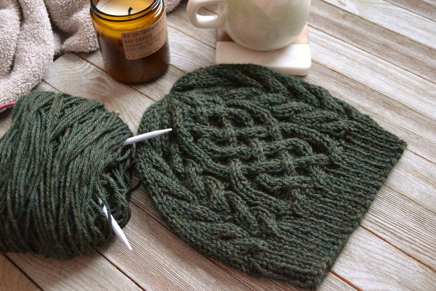 cable knit hat featuring a celtic braid up the middle with braids to each side