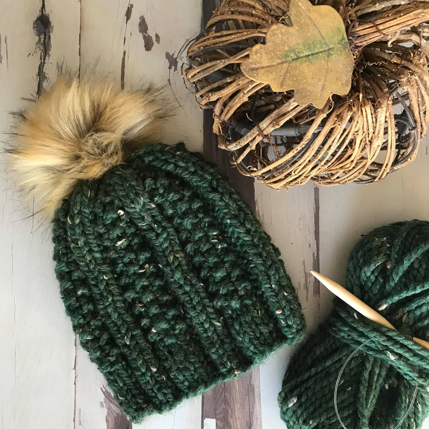 Super bulky knit hat with columns of knit stitch and seed stitch