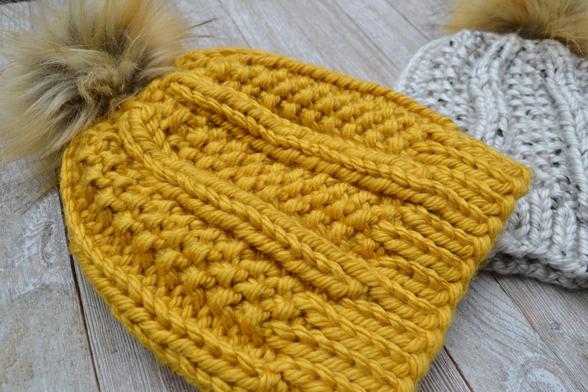 Super bulky knit hat with columns of knit stitch and seed stitch