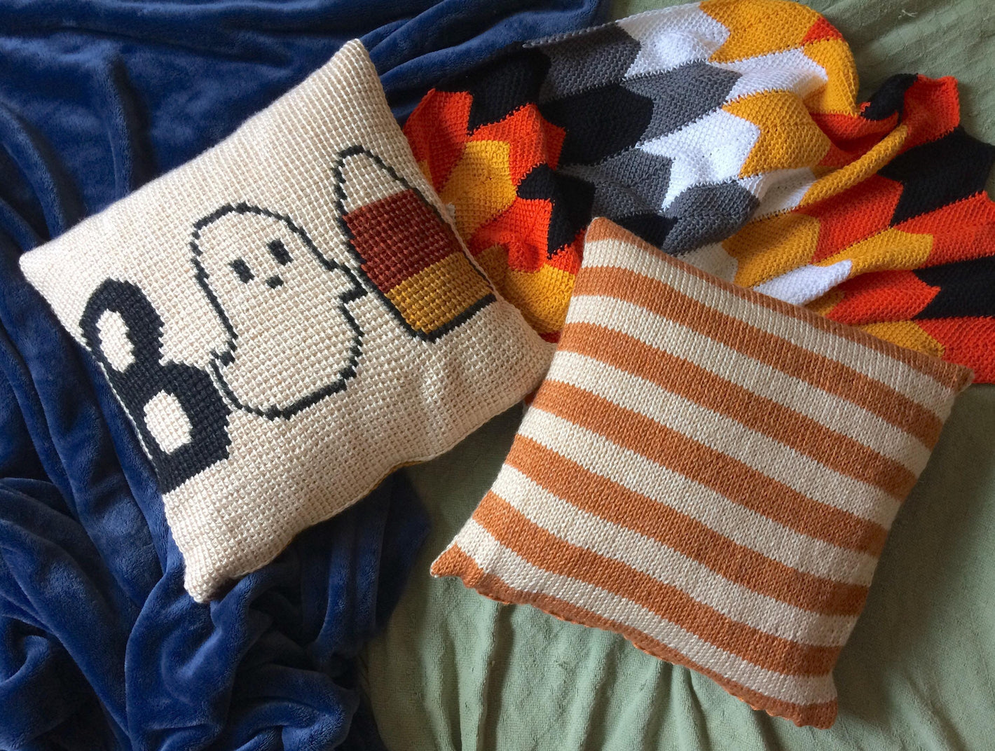 knit halloween pillow featuring a capital B, a Ghost, and a Candy Corn to represent BOO